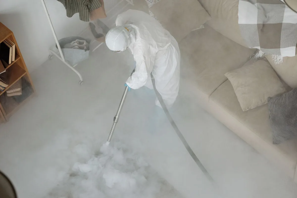Biohazard cleanup technician in protective equipment, Emmetsburg, IA